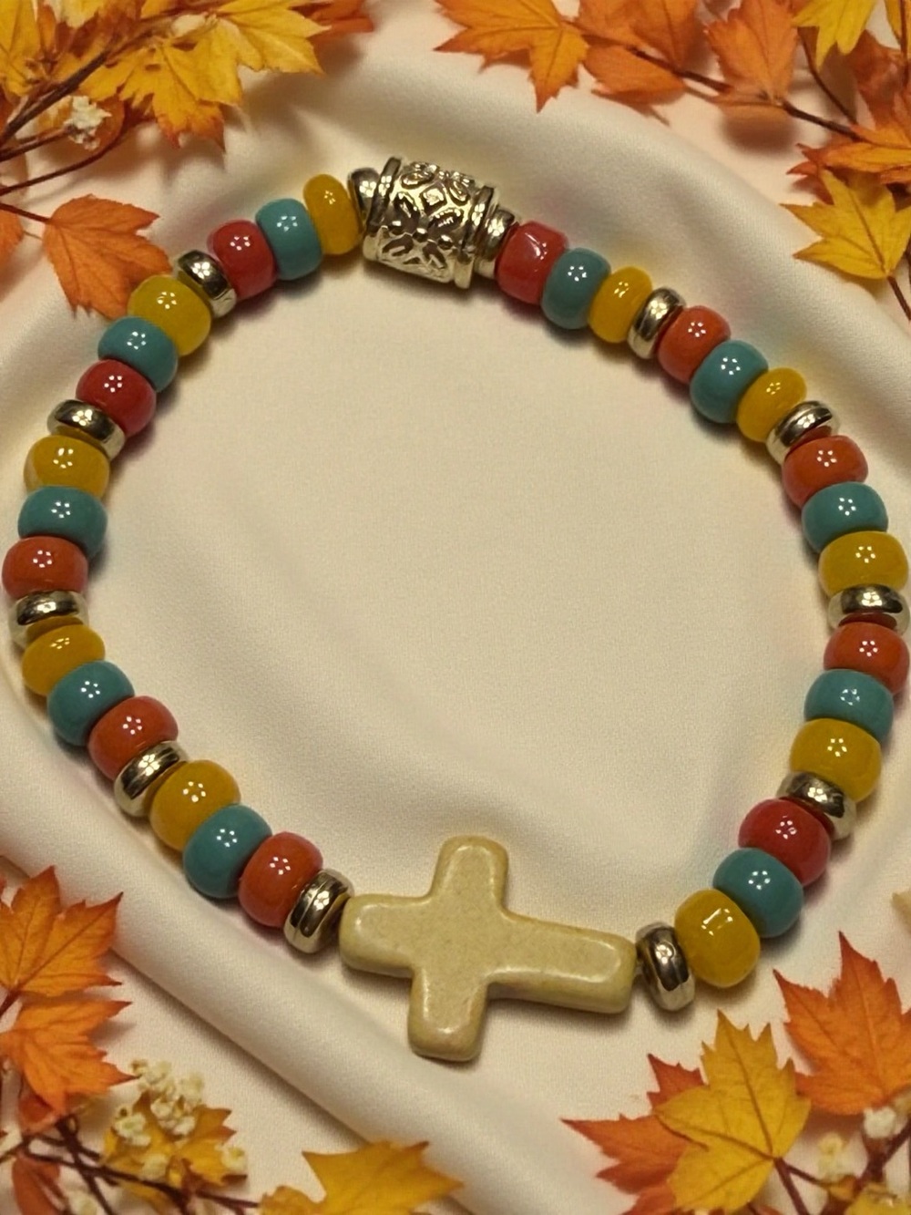Hand Crafted Multicolor Beaded Bracelet with Cream Cross Accent